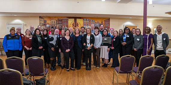 Group photo in a community hall setting