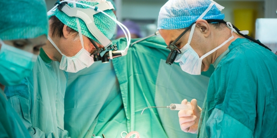 Surgeons operating on a patient