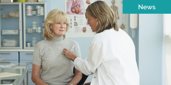Doctor Using Stethoscope On Senior Female Patient