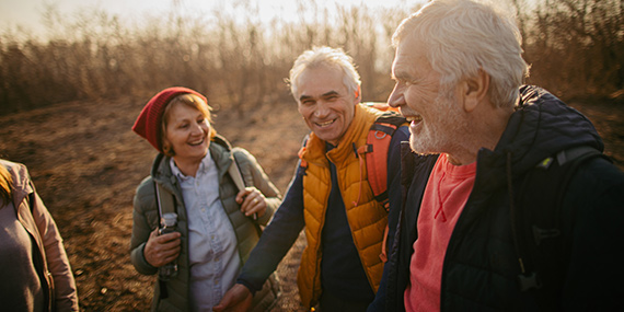 Group of senior people hiking together.