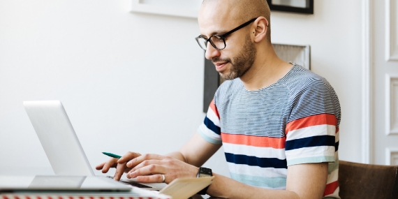Man on laptop at home