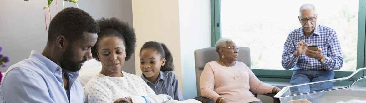 Children bringing mother flowers in hospital
