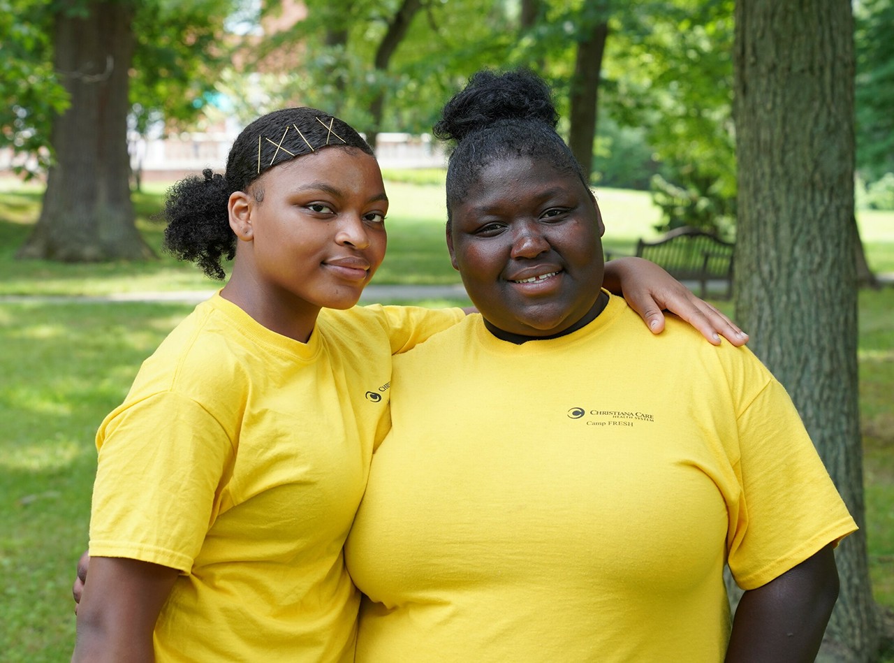 Two happy young friends from Camp FRESH