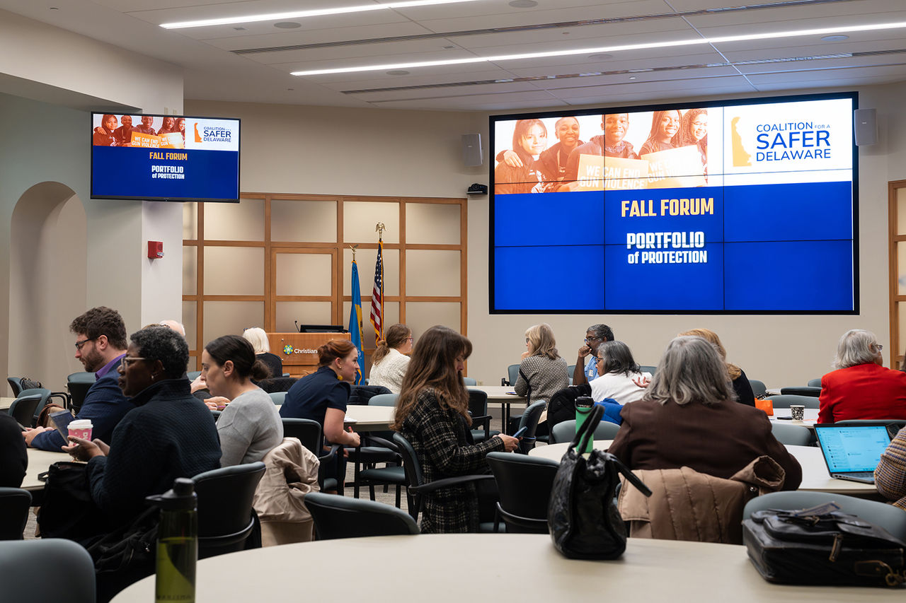 Attendees at the Fall Forum of a Coalition for a Safer Delaware sit around round tables