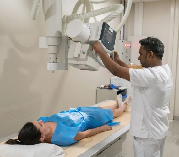 Patient lying down ready for an x-ray