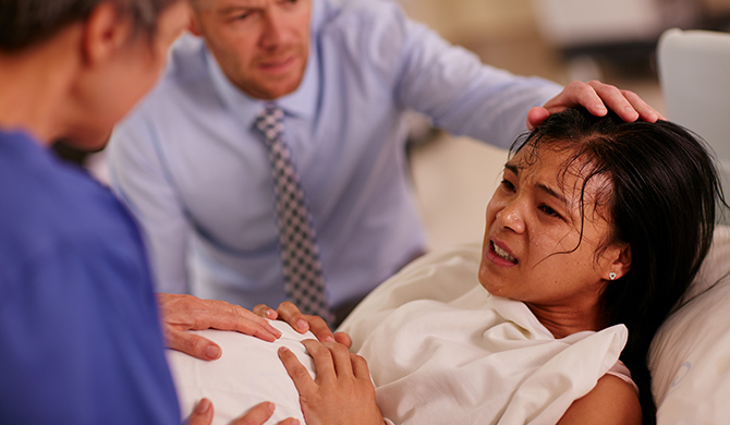 Woman giving birth