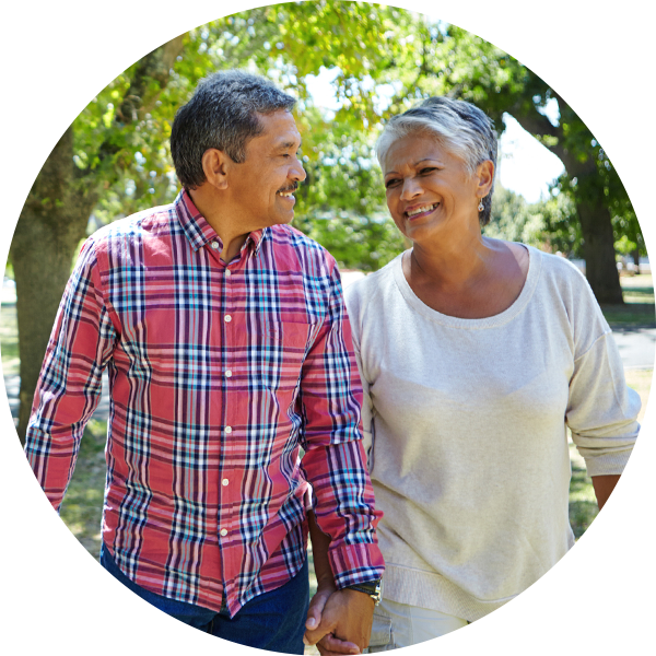 A senior couple walking together holding hands