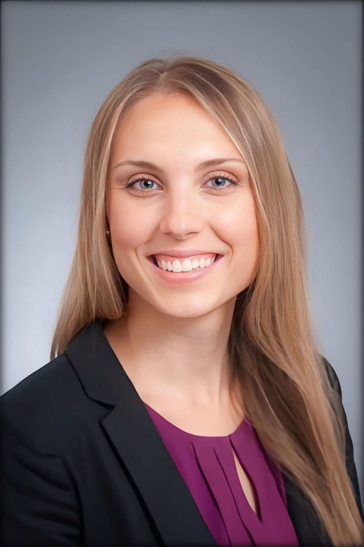 A headshot portrait of Ashlee Rowles