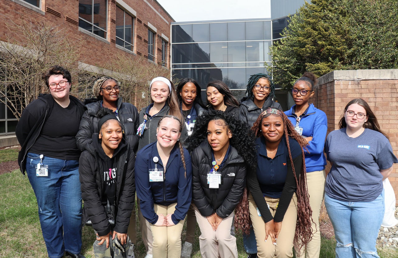 A group of ChristianaCare mobility interns poses together outside the facility.