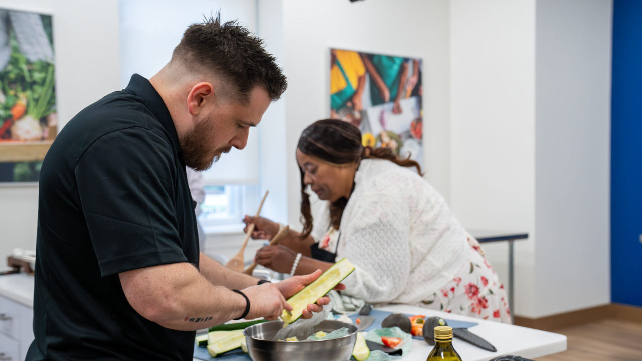 Arlene Daniels and Eric Lautz buy preparing food together