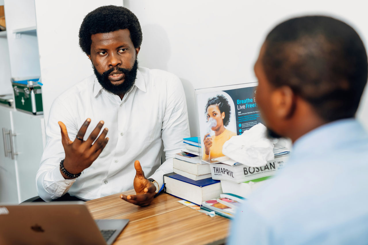 Male doctor consulting patient