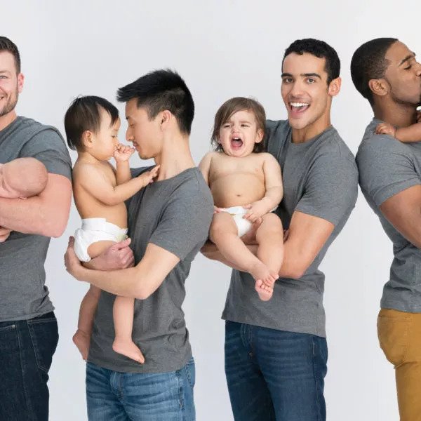 Group of happy dads with their babies